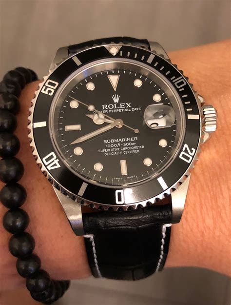 rolex submariner with black rubber strap|Rolex 114060 on leather strap.